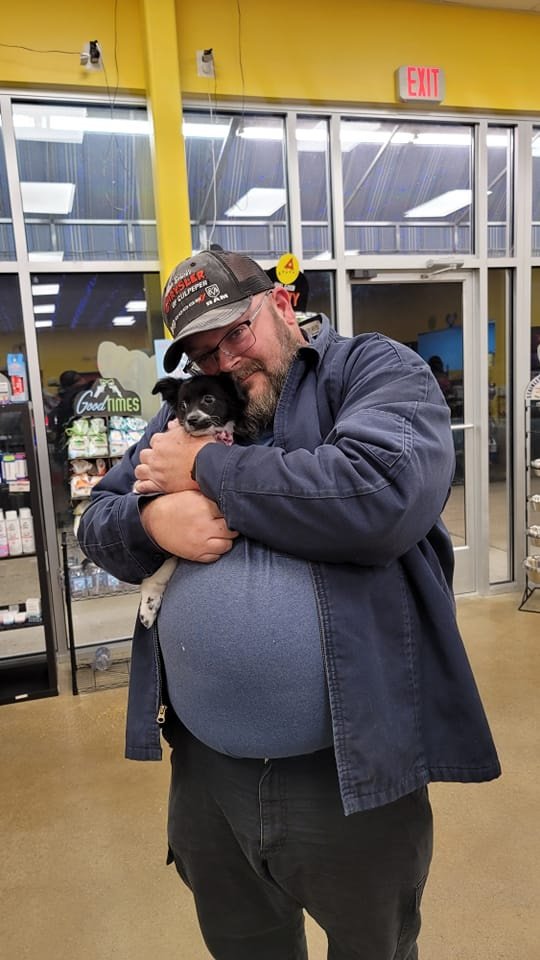 Jason Taylor with newly adopted dog.